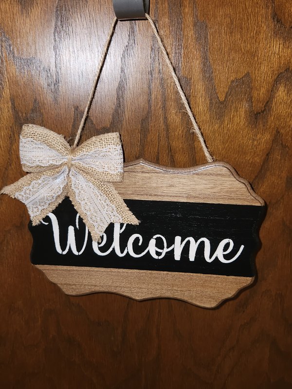 "Welcome" plaque sign with bow