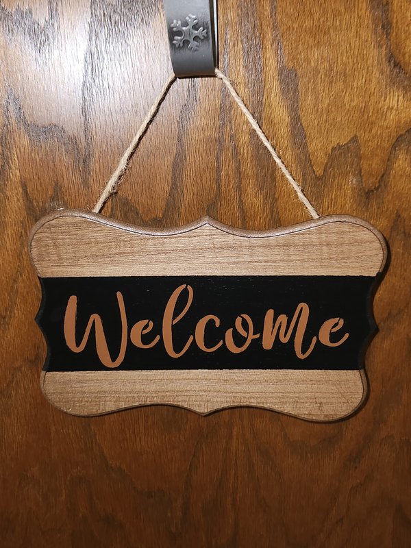 "Welcome" plaque sign