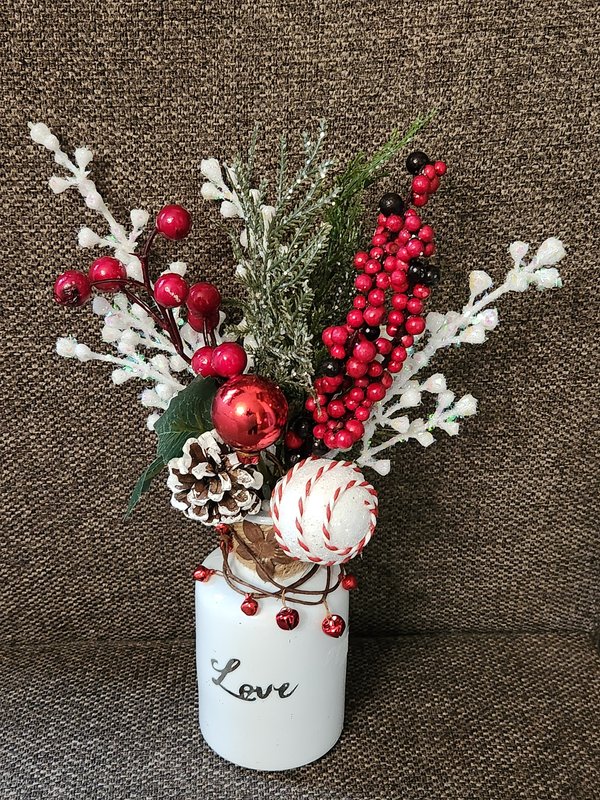 White "Love" vase, red holiday florals
