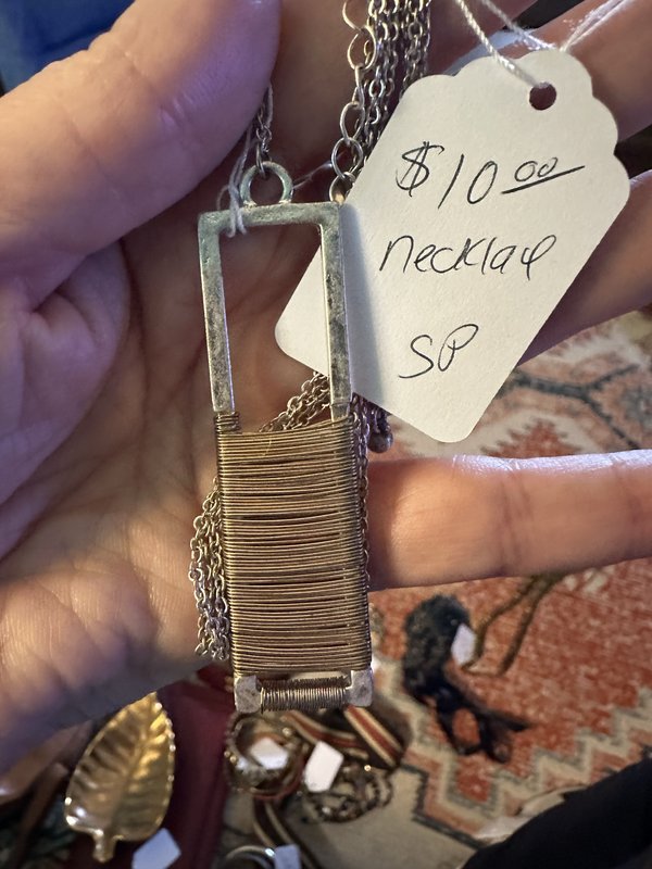 silver chain with gold/silver pendant