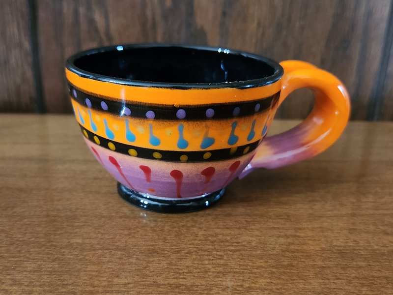 Orange handle tea cup