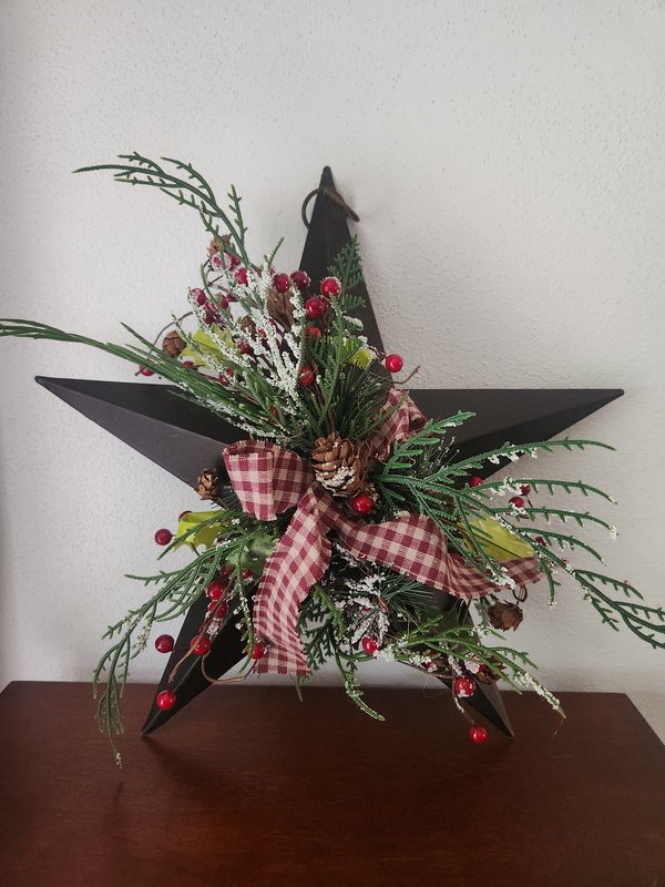 Metal star with holiday berry accents