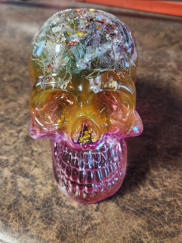 Resin skull, green and pink, with lights
